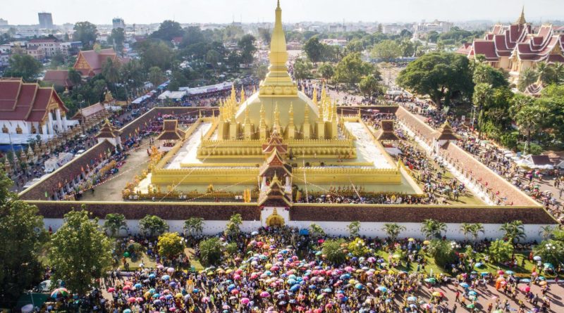 Time-Honoured Wax Castle Procession Pays Homage To That Luang Stupa